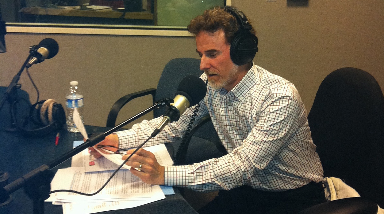 Doctor Strom in a recording booth for local radio